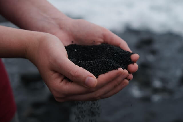 someone holding compost