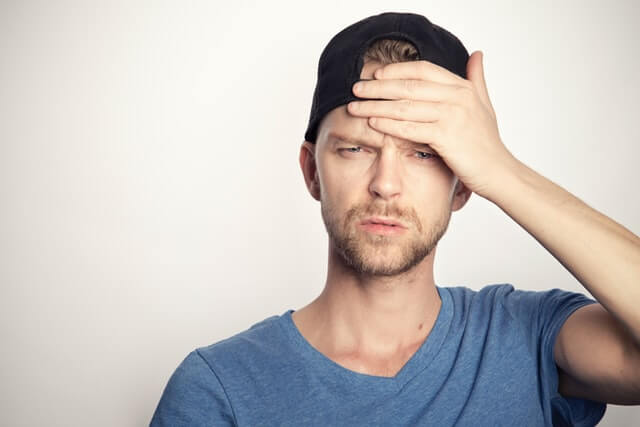 person worried, face on hand. 